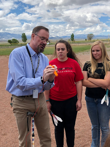 Students and Mr. Mac reviewing the launch