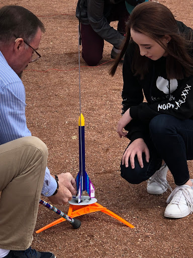 Mr. Mac works with a student pre-blast off.